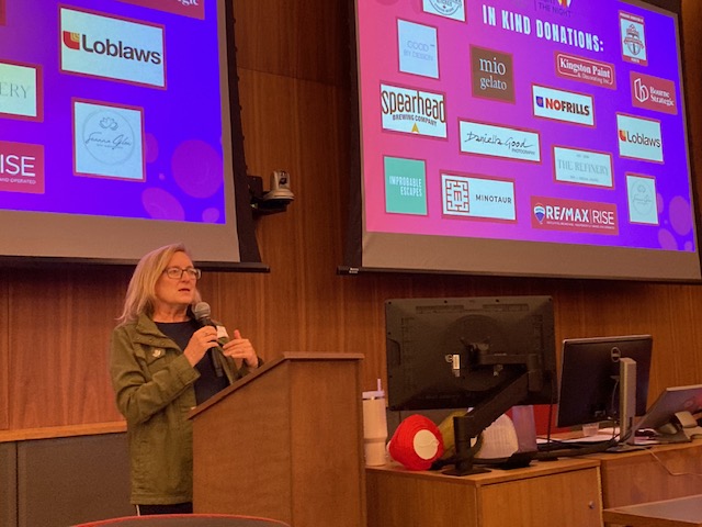 Conny speaking at a community event